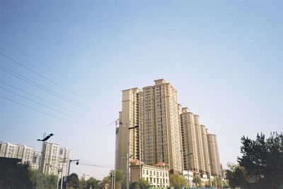 Low angle view of buildings against clear sky