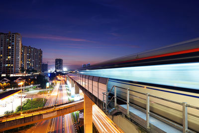 Light trails on city buildings at night