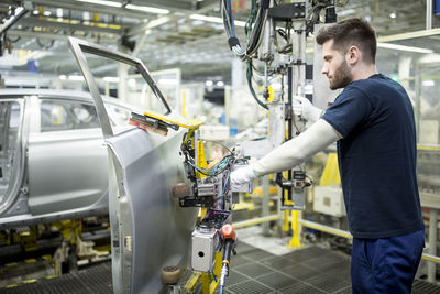 Man working in modern car factory