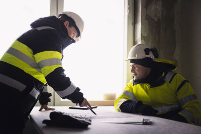 Engineers talking at building site