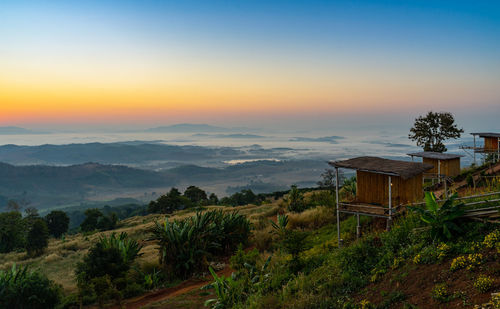 Scenic view of mountains against sky during sunset