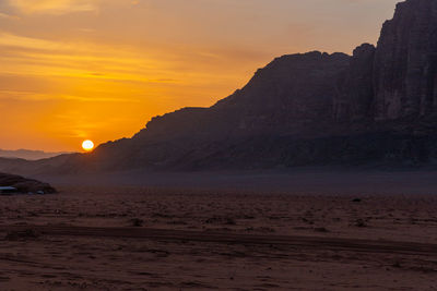 Scenic view of beach against sky during sunset