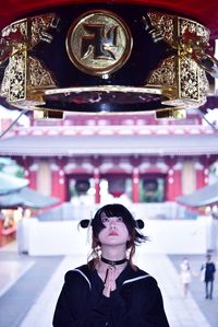 Close-up of woman standing in temple
