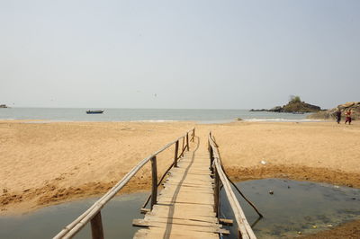 Scenic view of beach against clear sky