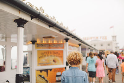 Rear view of woman at brighton pier