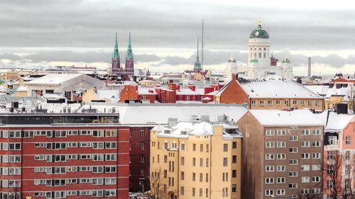High angle view of church against cloudy sky