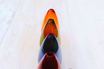 Close-up of vases in row on table