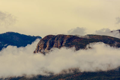 Clouds hover under the huachuca mountains
