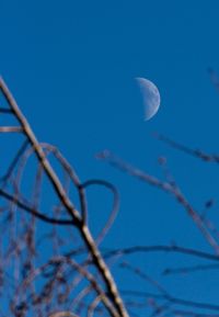 Scenic view of moon against clear blue sky