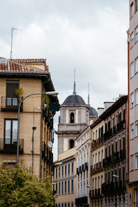 Buildings in city against sky