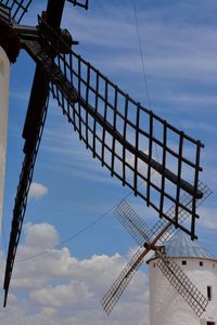 Low angle view of electricity pylon against sky