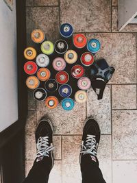 Low section of person standing on tiled floor