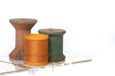 Close-up of objects on table against white background