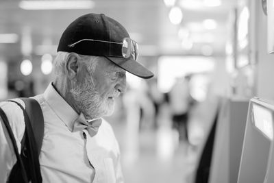 Close-up of man wearing cap