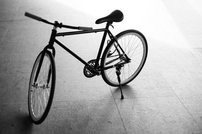 High angle view of bicycle parked on footpath