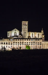 Buildings in city at night