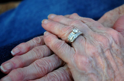 Cropped hand of senior woman wearing ring