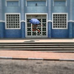 View of woman walking in city