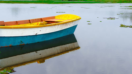 Boat moored in lake