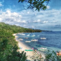 Scenic view of sea against cloudy sky