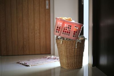 Close-up of clothes in baskets in floor