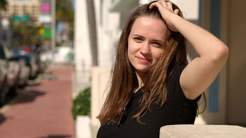 Portrait of young woman looking away