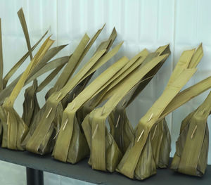 Close-up of fresh vegetables on table against white wall