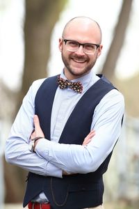 Portrait of smiling man with arms crossed