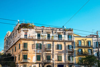 Low angle view of residential building against clear sky