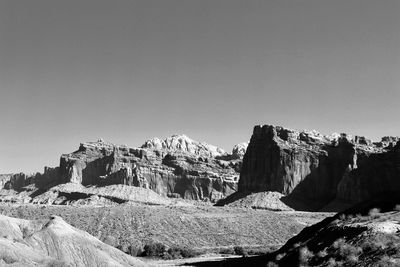 Rock formations on landscape against clear sky