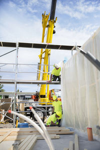 Workers building house