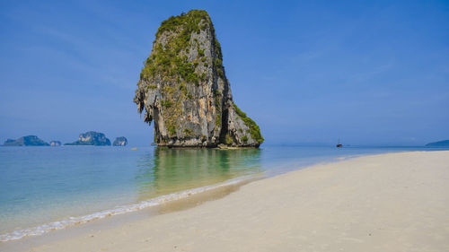 Scenic view of sea against clear blue sky