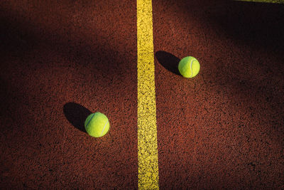 High angle view of tennis balls on field