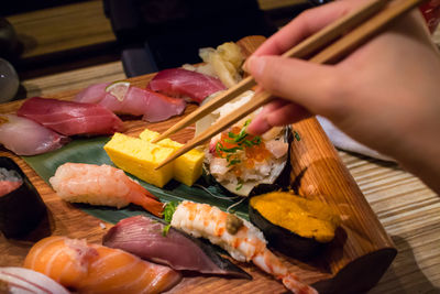 Close-up of sushi on wooden tray