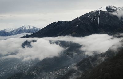 Scenic view of mountains against cloudy sky