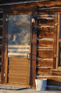 Closed door of log cabin