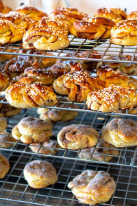 High angle view of buns on metal grate