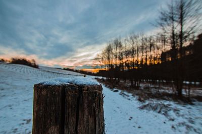 Frozen lake against sky during winter