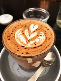 Close-up of cappuccino on coffee cup