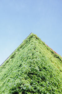 Low angle view of built structure against clear blue sky