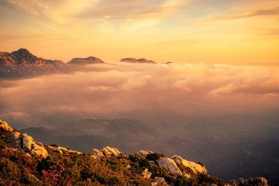 Scenic view of mountains against sky during sunset