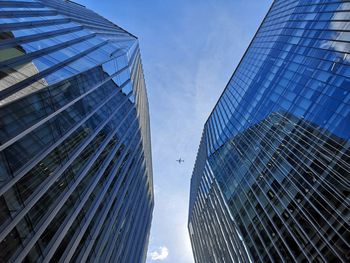 Low angle view of modern buildings against sky