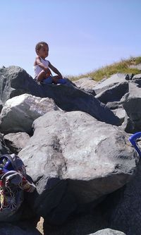 Full length of woman standing on rock