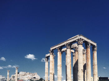 Low angle view of historical building against blue sky