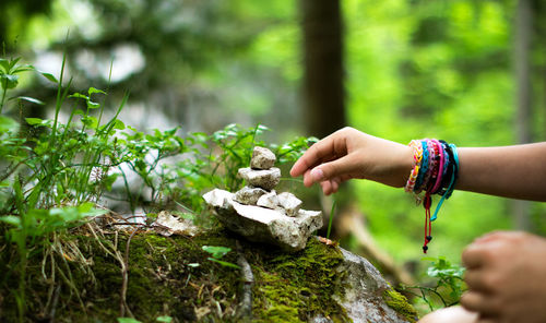 Midsection of woman building stones