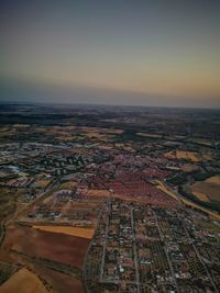 High angle view of buildings against sky during sunset