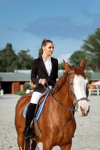 Young man riding horse