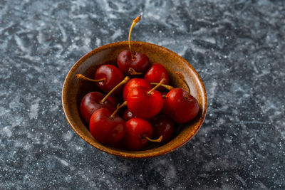 High angle view of strawberries in bowl on table