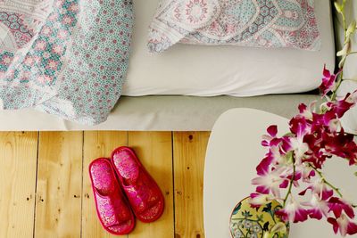 Pink petals on bed at home