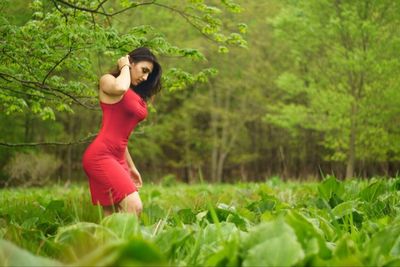 Woman standing on grass